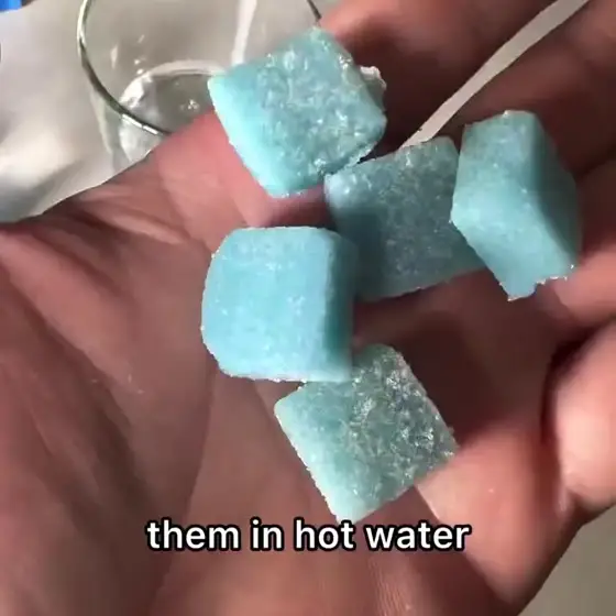 Gummies going into hot water, the water turning cloudy, then the glass inverted to show creatine sediment stuck to the bottom